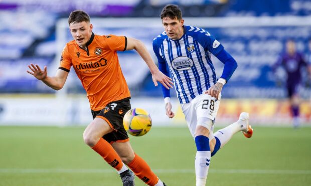 Dundee United fledgling Kerr Smith tracks Kilmarnock's Kyle Lafferty in one of his five appearances last season.
