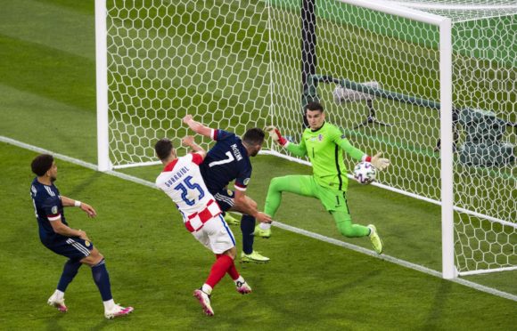 John McGinn came close to pulling a goal back for Scotland as they crashed out of Euro 2020 with defeat to Croatia