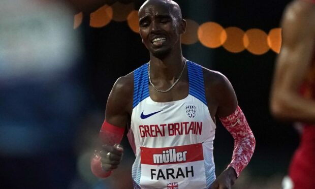Great Britain's Sir Mo Farah toils in the Olympic trial.