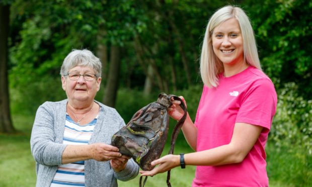 Shelagh with her handbag that was stolen from her home in Glenrothes nearly 20 years ago, with Gillian Spence from Fife Street Champions.
