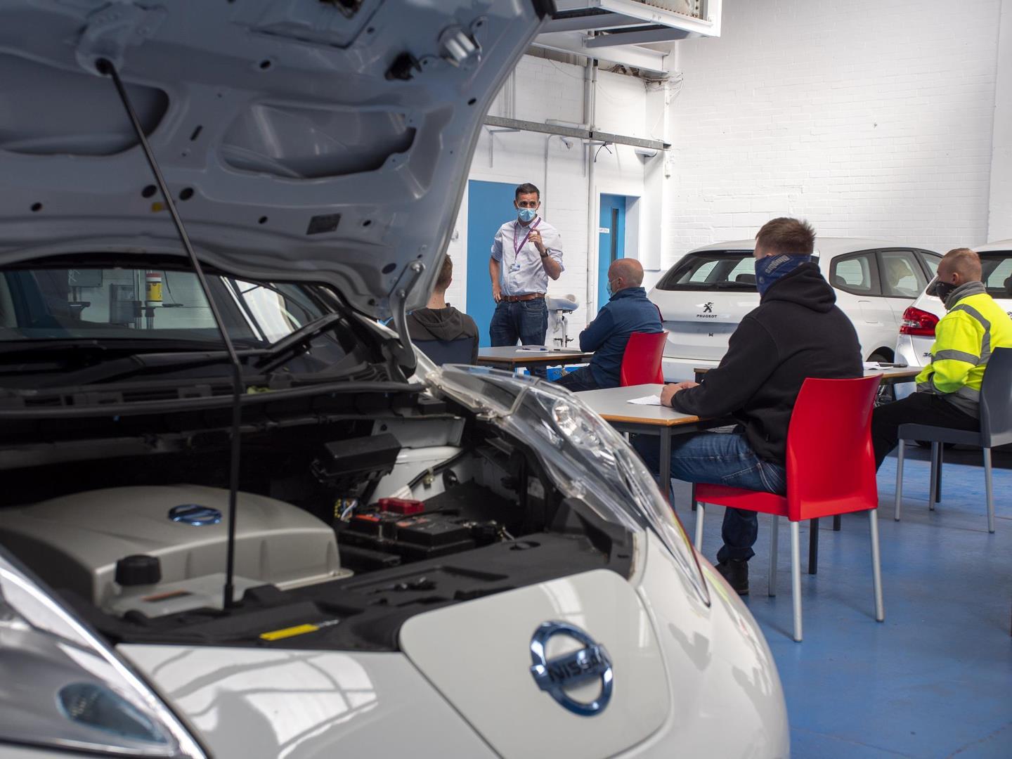 Students undertaking electric vehicle training at Dundee College