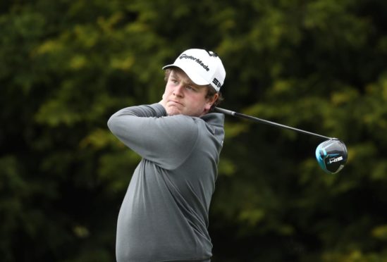 Robert MacIntyre in mid-swing at the British Masters in 2021