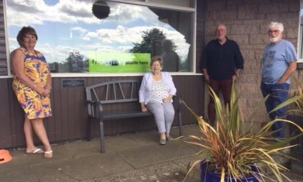 Freda Wells, Zena Nairn, Dave Ramsay and Ian Esplin with the Meadowbank Inn memorial bench to Johnny Mac.