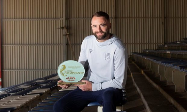 Dundee boss James McPake with the award.