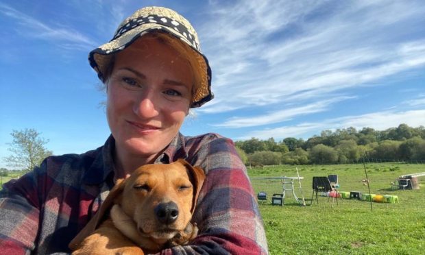 Jessie Probst with Dachshund Faith, who she rescued from China.