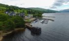 Aerial view of the Crannog Centre with Taymouth marina behind