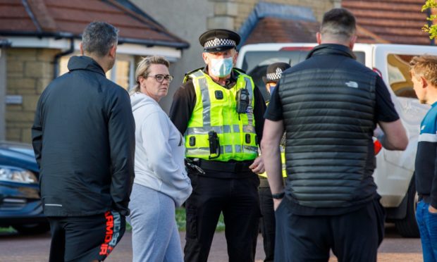 A small crowd gathered to protest in the Fife community