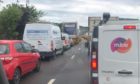 Long tailbacks formed for morning commuters following a two-car collision on the M90 near Halbeath.