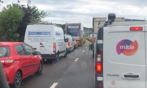 Long tailbacks formed for morning commuters following a two-car collision on the M90 near Halbeath.