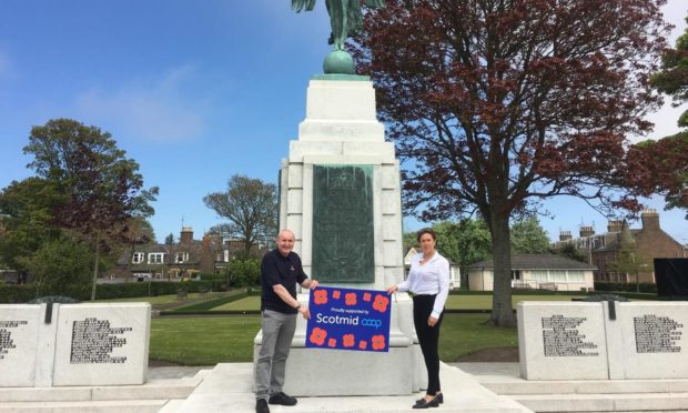 Jim Strachan of Poppy Scotland Montrose and Lynne Ogg of Scotmid at the Montrose cenotaph.