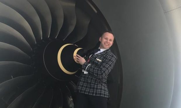 Ross Greig during his time as an airline cabin crew member.