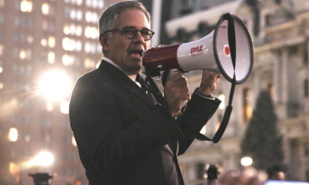 Larry Krasner with bullhorn at a rally in Philly DA.
