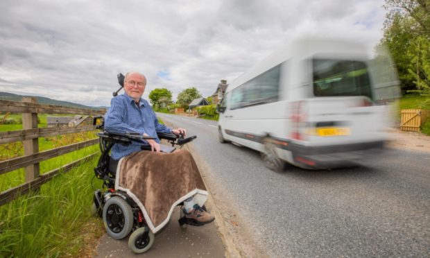 Garry Stagg next to the dangerous stretch of the A827