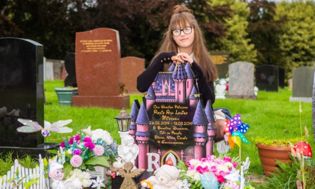 Natasha-Lee McGilligan at Roxie's grave.