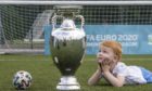 Handout photo dated 02/06/2021 provided by JSHPIX of Glasgow youngster Hugo getting their first look at Euro 2020 trophy as the Henri Delaunay Cup made a special visit to Glasgows Walking Football programme today as part of the UEFA EURO 2020 Trophy Tour. Issue date: Wednesday June 2, 2021. PA Photo. The iconic trophy is visiting a small number of community events in the city as excitement builds ahead of Scotlands first match against the Czech Republic at Hampden Park. Photo credit should read: Jeff Holmes/PA Wire. NOTE TO EDITORS: This handout photo may only be used in for editorial reporting purposes for the contemporaneous illustration of events, things or the people in the image or facts mentioned in the caption. Reuse of the picture may require further permission from the copyright holder.