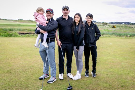 Iain Evans and two-year-old daughter, Rosie and David McFarlane with children Cara, 16, and Aidan, 12.