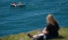 People kayak in the sea near to Durdle Door in Dorset, on the first day of meteorological summer. Picture date: Tuesday June 1, 2021. PA Photo. The UK could see record temperatures for the second day in a row after the mercury hit 25C for the warmest day of the year so far on Bank Holiday Monday. See PA story WEATHER Summer. Photo credit should read: Andrew Matthews/PA Wire