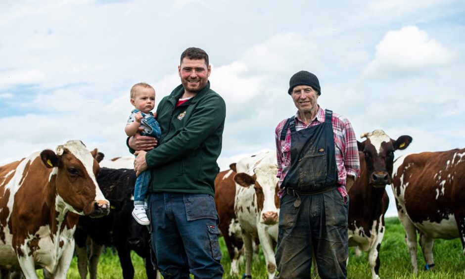 Richard Fisher, left, with his son, Owen, and father, Alexander
