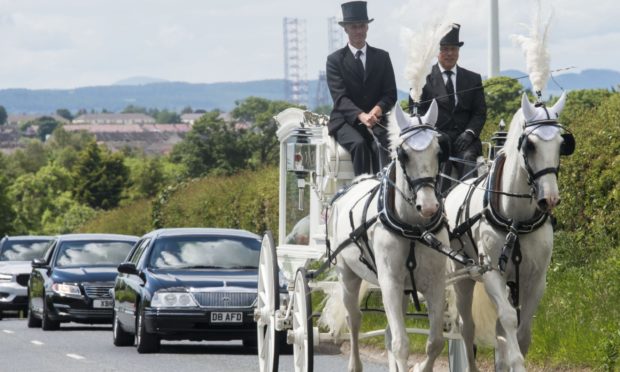 The horse-drawn carriage on its way to Pitkerro Grove Cemetery for the funeral of baby Willow Heggie.