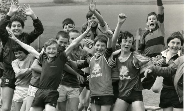 The boys of Whitfield Primary School grab the attention of the camera man as they take a break from the sports day action in June 1983.