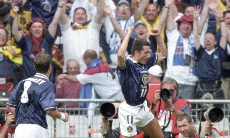 John Collins celebrates after equalising for Scotland against Brazil in the opening game of France '98