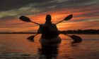 Kayakers enjoy the sunset on Cameron Lake, just off the Canada Trail near Fenelon Falls, Ont.,
