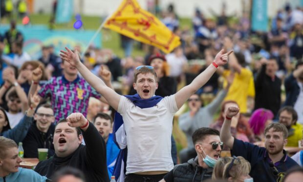 Fans attend to watch England v Scotland at the Euro Fan Zone .