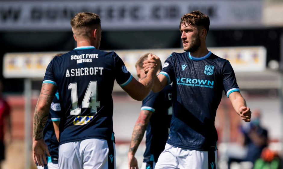 Corey Panter (right) celebrates a debut goal for Dundee. Image: SNS.