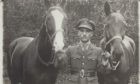 Captain Alexander Wallace with his distinctive chestnut and white mare, Vic, and another war horse. Supplied by Montrose Air Station Heritage Centre.