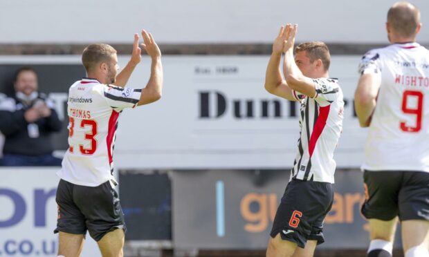 Dom Thomas celebrates