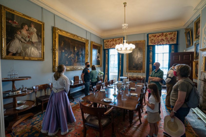 Visitors enjoy a guided tour of the House of Dun.