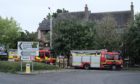 Three fire crews called to tackle blaze at a block of flats in Kirkcaldy.
