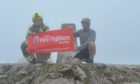Stefan Barr and Darren Ross at the summit of Ben Nevis.