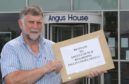 Inveresk Community Council chairman Gus Leighton with the Inglis Court petition. Pic: Gareth Jennings/DCT Media