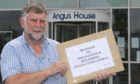 Inveresk Community Council chairman Gus Leighton with the Inglis Court petition. Pic: Gareth Jennings/DCT Media