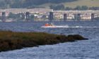 A search is ongoing on the Tay for paddleboarders reported to be in difficulty.