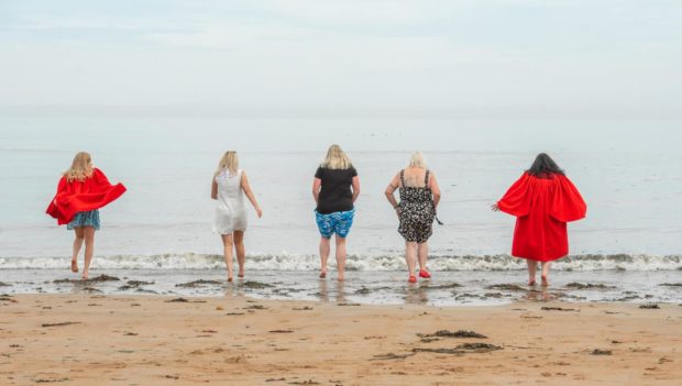 Rhiannon is also pictured having a paddle in the North Sea with Geography classmates (left to right) Yvonne Smith, Audrey Field, Katrina Peattie and Sarah Ramage.