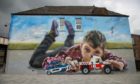 Kerry Wilson's stunning mural of a young boy in Cowdenbeath High Street.