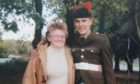 Kevin Elliott in army uniform with his arm round his grandmother Joan Humphreys