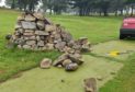 A stone cairn was damaged at Lochgelly Golf Club.