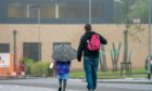 Calls have been made for all parents to be allowed on school grounds when dropping off younger pupils when the new school year begins next month.