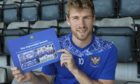 David Wotherspoon holds St Johnstone's cup double photo book.