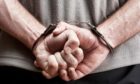 Stock photo: Prisoner in handcuffs