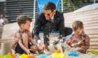 Dundee City Council leader John Alexander playing in the sand at the newly opened urban beach with his kids Jack, 5, and Noah, 4.