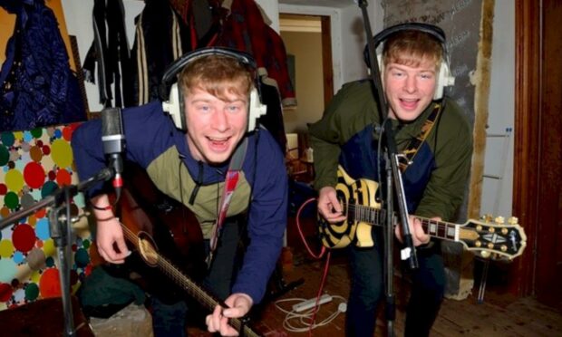Identical Fife twins Donald and Stuart Mackay having fun in the studio.