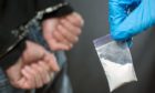 Stock image of police with bag of cocaine