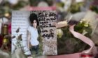 Tributes outside the Camden home of Amy Winehouse following her death.