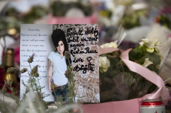 Tributes outside the Camden home of Amy Winehouse following her death.