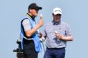 Robert MacIntyre and his caddie Mike Thomson find time for a 99 at Royal St George's.