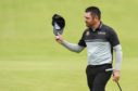 Mandatory Credit: Photo by Greig Cowie/Shutterstock (12205755ct)
Louis Oosthuizen acknowledges the crowd after holing a crucial par put on the 18th to lead the open on -6
The British Open Golf, Day One, Royal St George's, Kent, UK - 15 Jul 2021